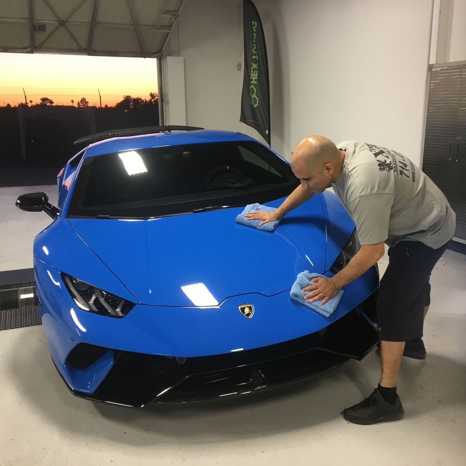 Vehicle with a freshly installed ceramic coating beading water at Xtreme Xcellence Detailing